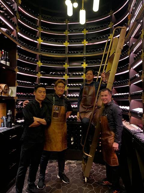 Youngbock Lee with the sommelier team at Burnt Ends' wine cellar
